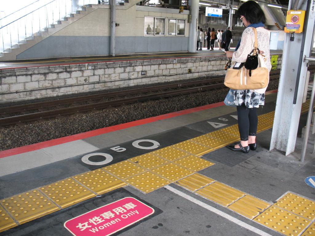 Platform indicators of a circle representing "local" and a triangle representing "express". The number refers to the number of the car on the train. These points designate where the doors on the train will align.