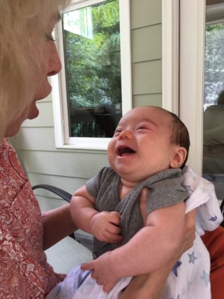 Aunt Lisa holding smiling Myron 