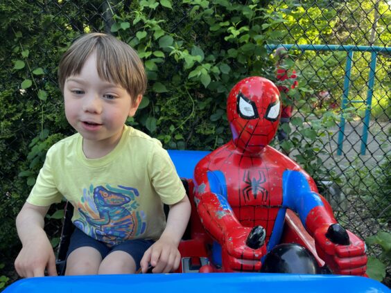 Myron sitting next to Spider Man figure